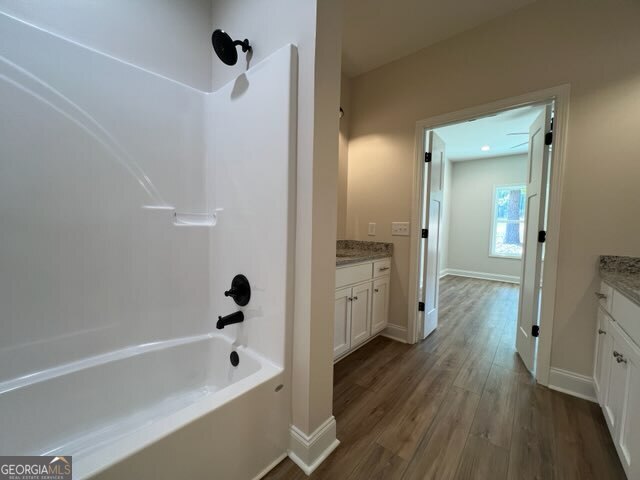 1251 South L Street Hamilton, GA 31811 - Photo 24 of 39 a bathroom with a tub shower and a mirror