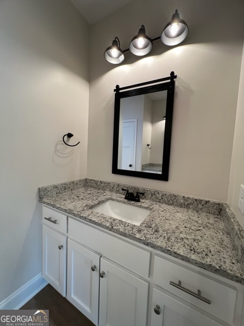 1251 South L Street Hamilton, GA 31811 - Photo 25 of 39 a bathroom with a granite countertop sink and a mirror