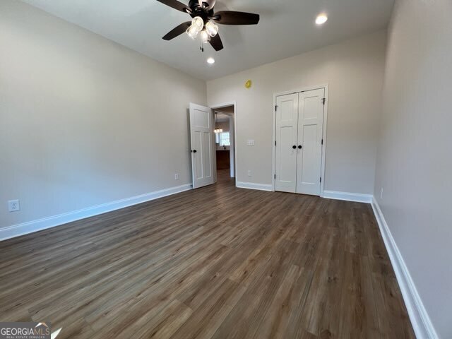 1251 South L Street Hamilton, GA 31811 - Photo 28 of 39 wooden floor in an empty room with a window