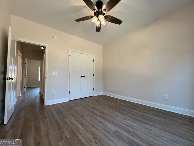 1251 South L Street Hamilton, GA 31811 - Photo 31 of 39 wooden floor in an empty room with a window
