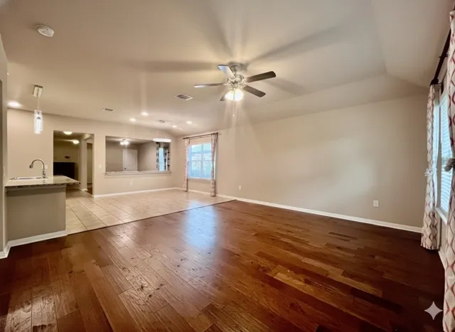 a kitchen with stainless steel appliances granite countertop wooden cabinets a stove top oven and granite counter tops