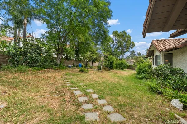 a backyard of a house with lots of green space