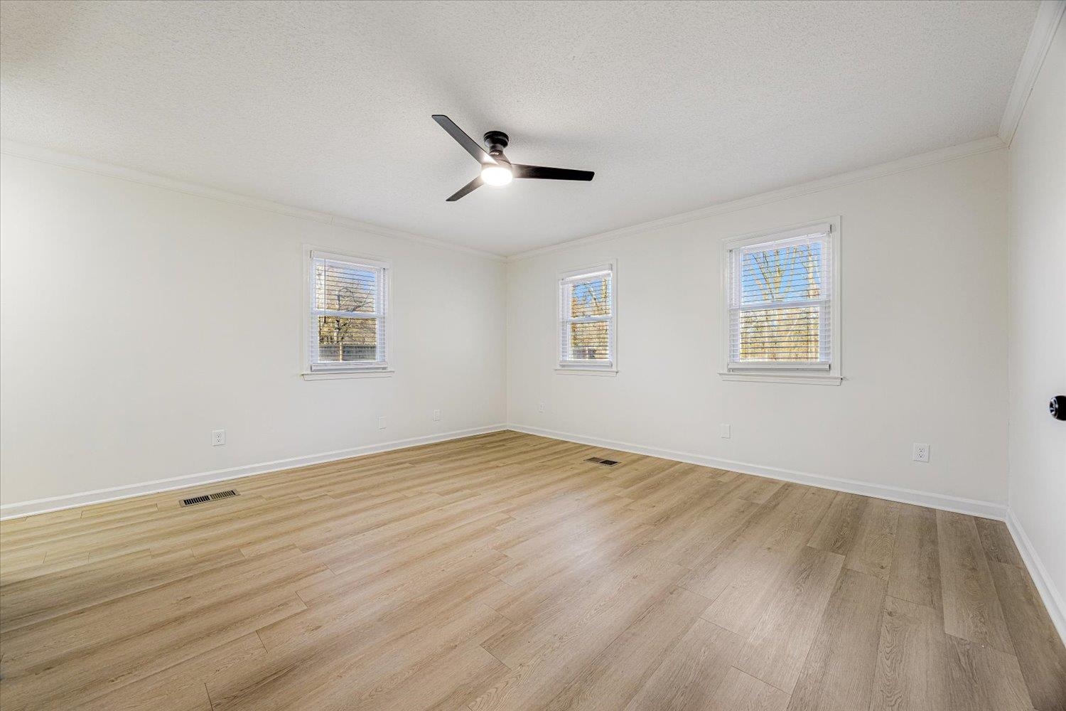 3148 Beaver Road Munford, TN 38058 - Photo 14 of 26 a view of empty room with wooden floor and fan