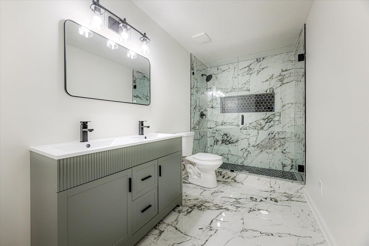 3148 Beaver Road Munford, TN 38058 - Photo 16 of 26 a bathroom with a toilet sink and mirror