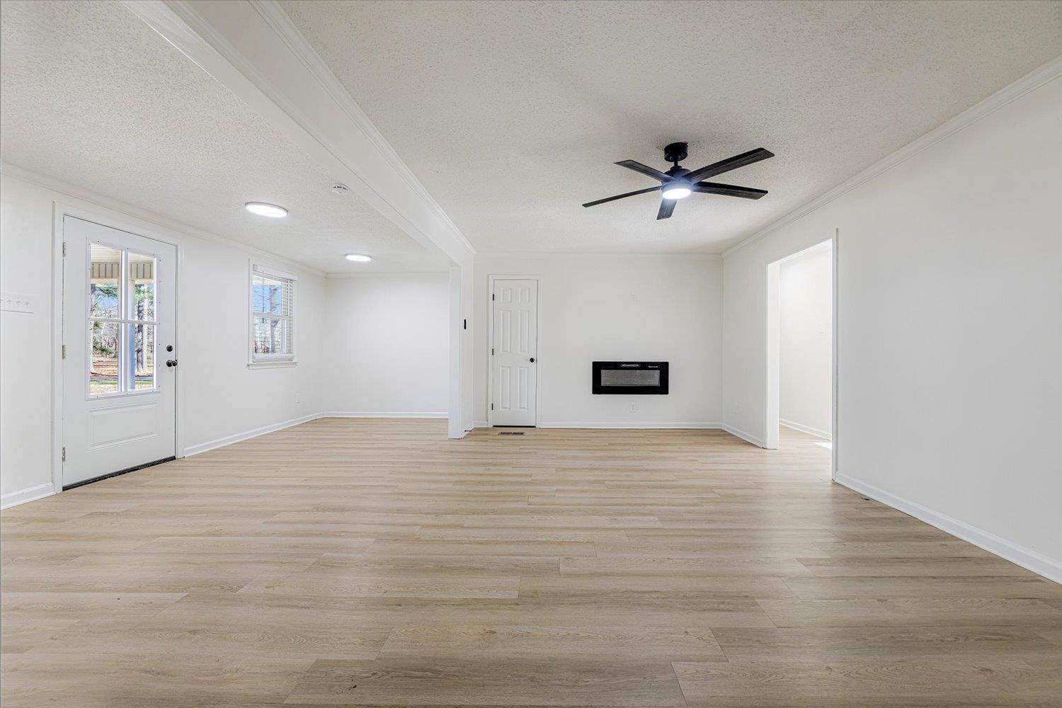 3148 Beaver Road Munford, TN 38058 - Photo 7 of 26 a view of empty room with wooden floor and fan