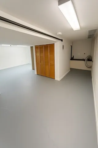 a view of a yard with wooden fence