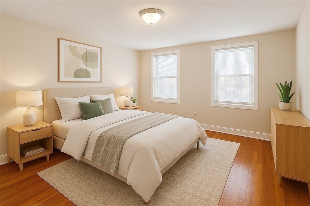 39 Silvia Court, Unit 39 Boston, MA 02136 - Photo 2 of 20 a bedroom with a bed and wooden floor