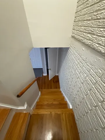 a view of entryway with wooden floor