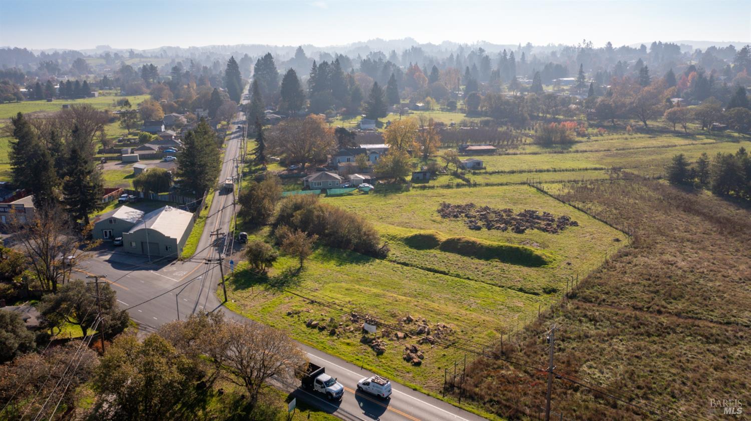a view of a swimming pool with a yard and mountain view