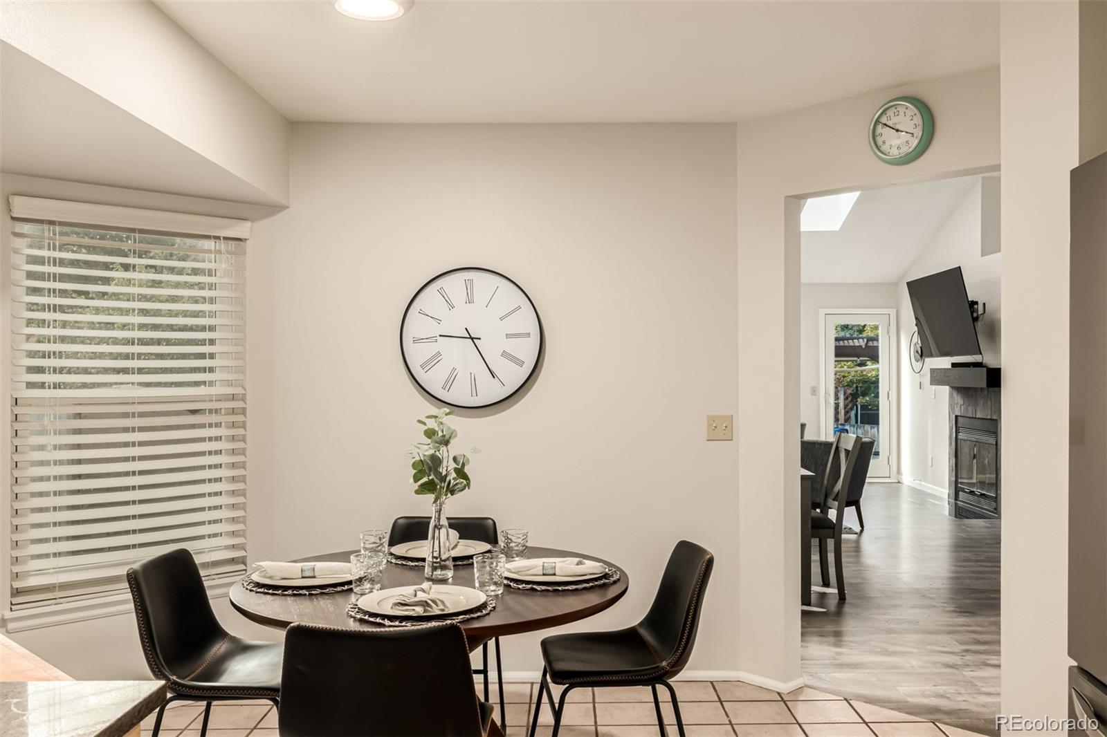 8837 South Cactus Flower Way Highlands Ranch, CO 80126 - Photo 13 of 42 a view of a dining room with furniture and window