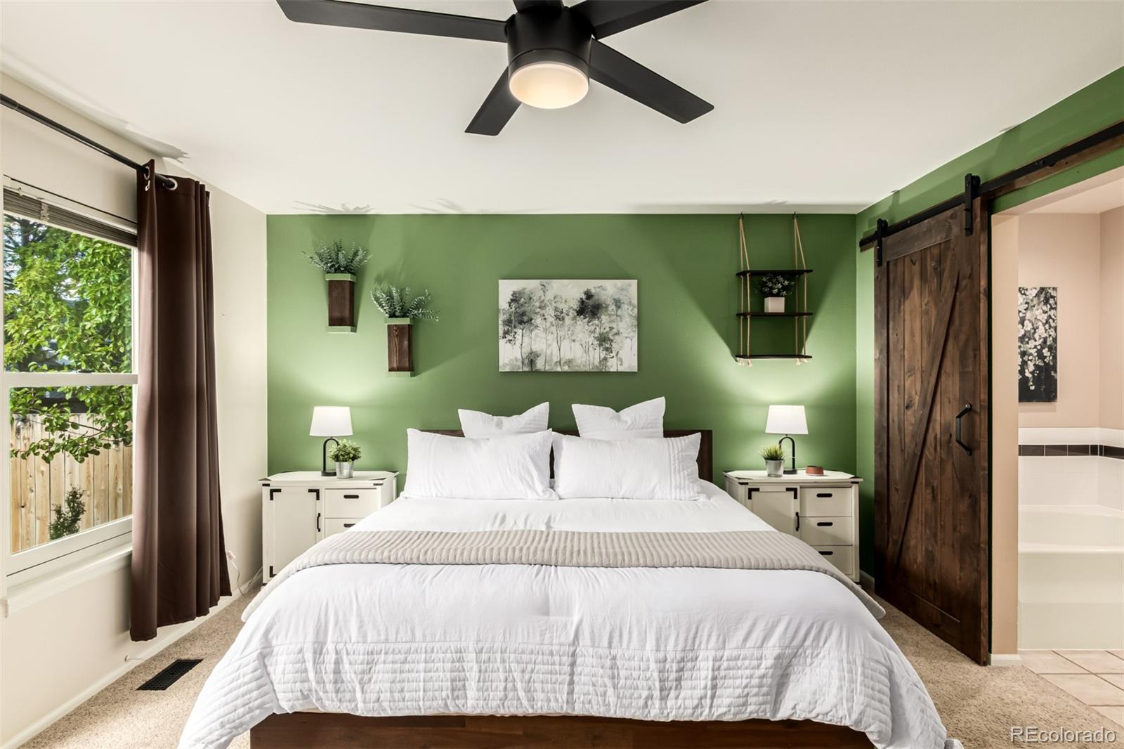 8837 South Cactus Flower Way Highlands Ranch, CO 80126 - Photo 19 of 42 a bedroom with a bed and a window
