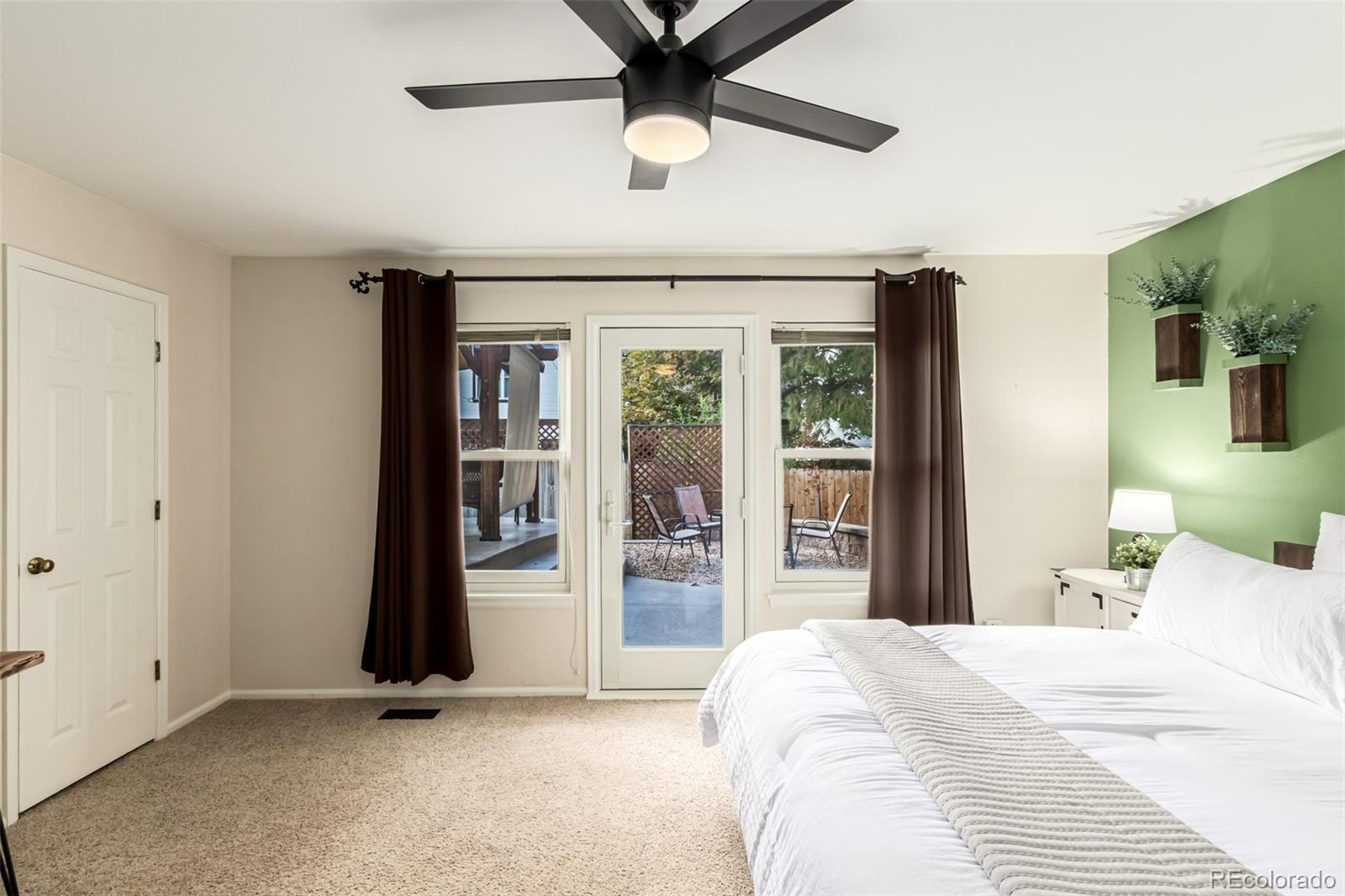 8837 South Cactus Flower Way Highlands Ranch, CO 80126 - Photo 20 of 42 a bedroom with a bed and a large window