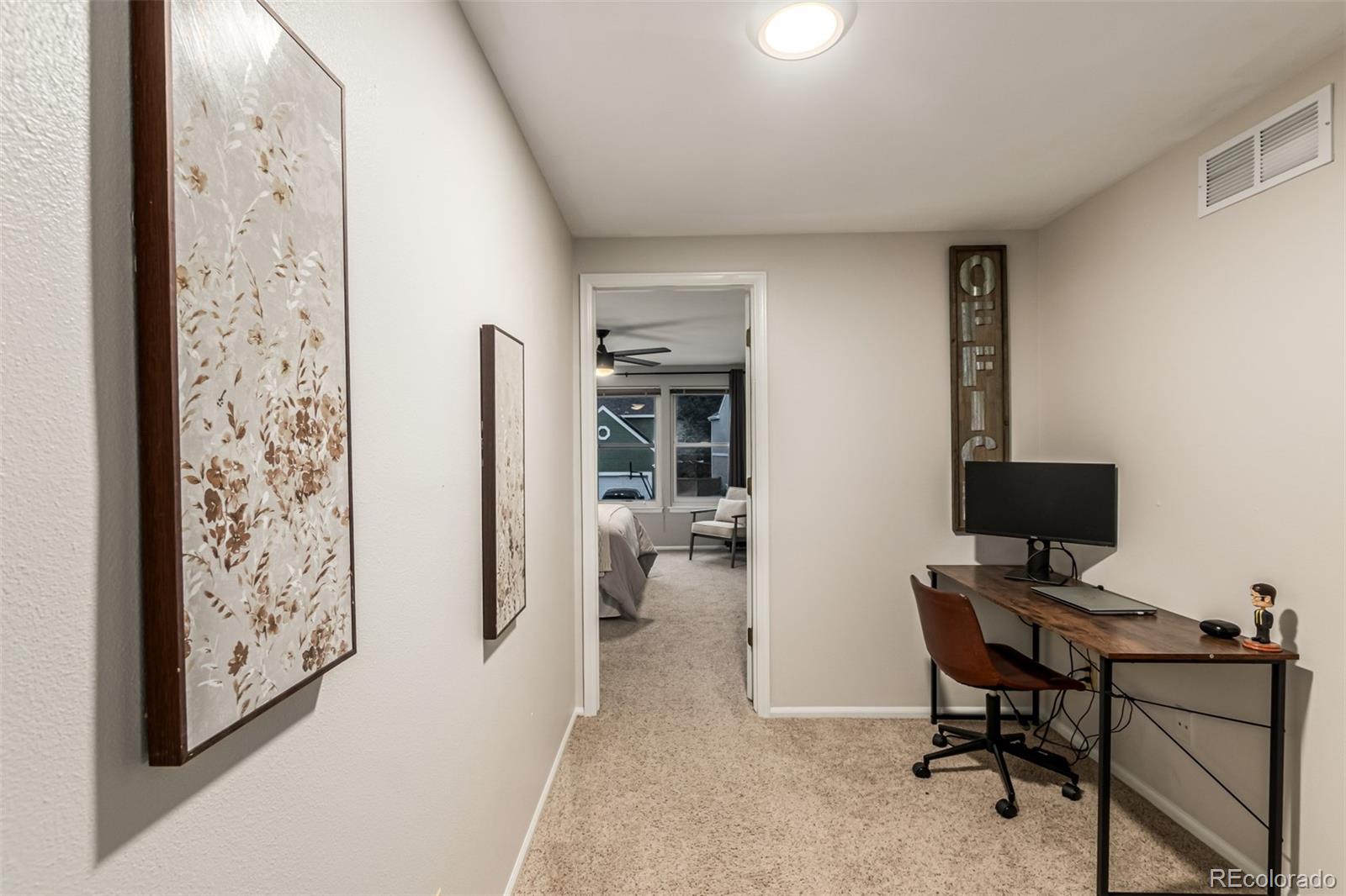 8837 South Cactus Flower Way Highlands Ranch, CO 80126 - Photo 25 of 42 a view of a workspace with furniture and a window