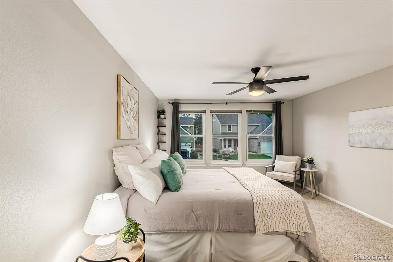 8837 South Cactus Flower Way Highlands Ranch, CO 80126 - Photo 29 of 42 a spacious bedroom with a bed and window