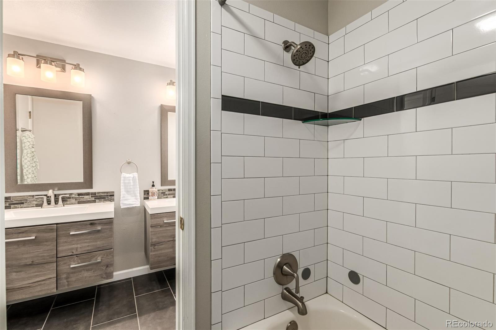 8837 South Cactus Flower Way Highlands Ranch, CO 80126 - Photo 32 of 42 a bathroom with a sink shower and a mirror