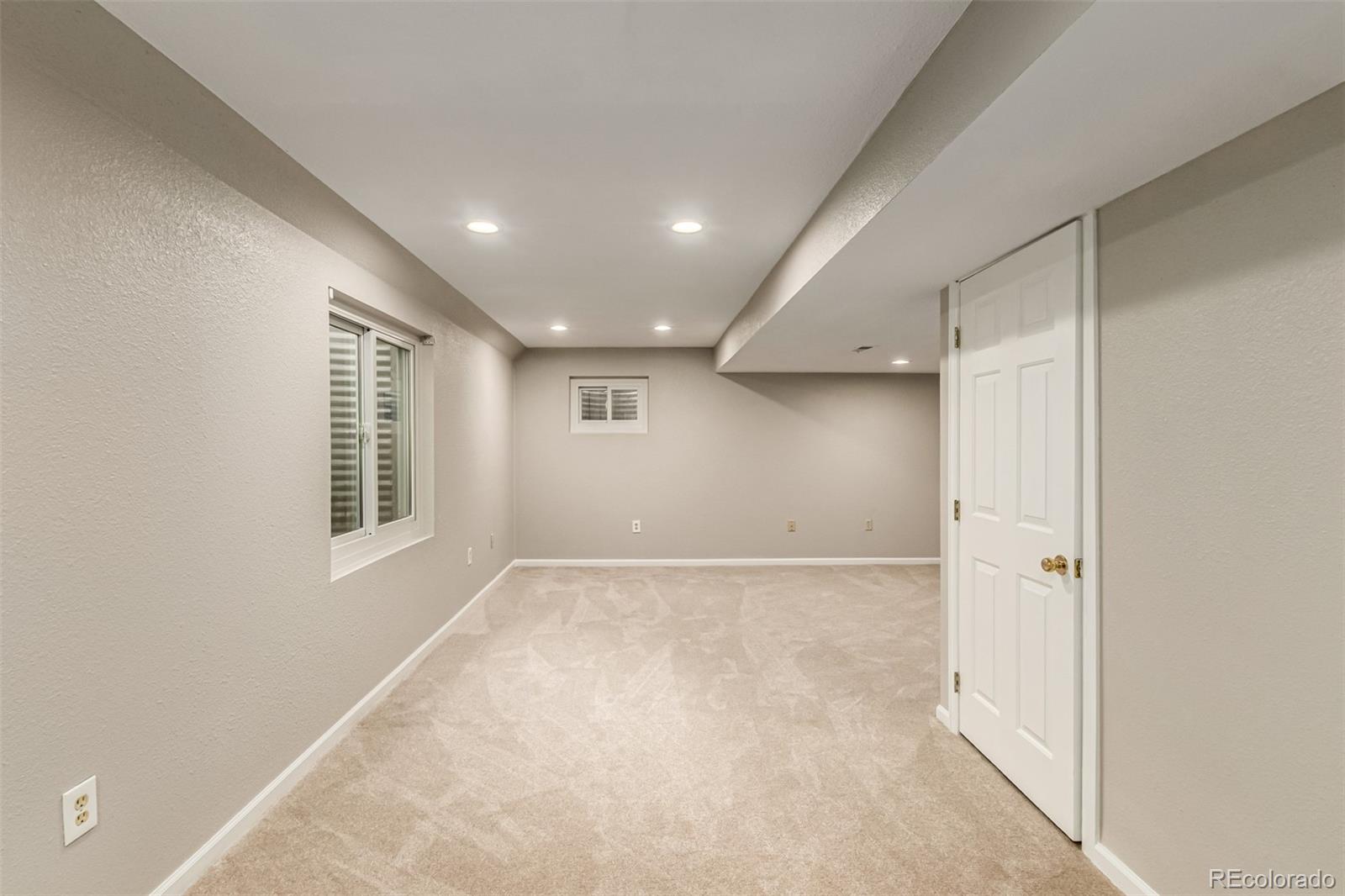 8837 South Cactus Flower Way Highlands Ranch, CO 80126 - Photo 33 of 42 an empty room with windows and closet