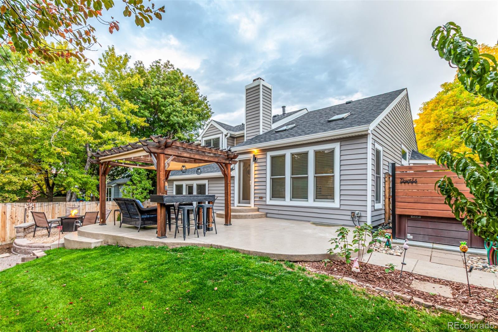 8837 South Cactus Flower Way Highlands Ranch, CO 80126 - Photo 39 of 42 a front view of a house with a garden