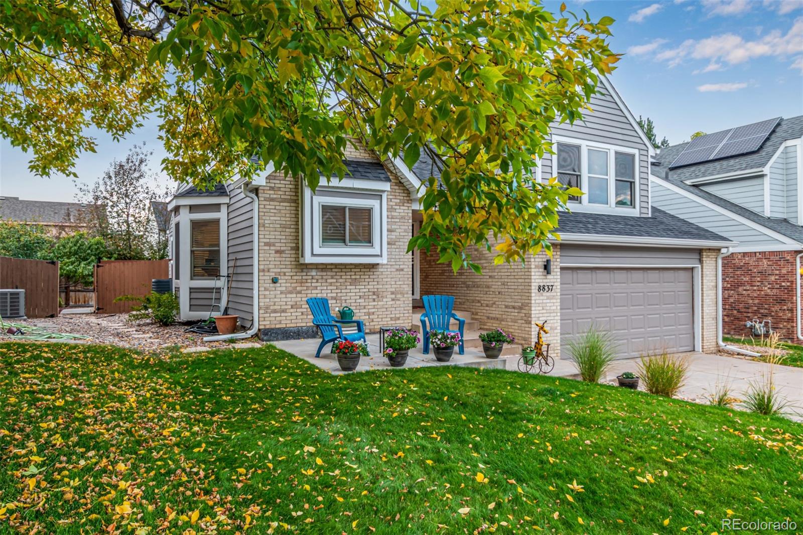 8837 South Cactus Flower Way Highlands Ranch, CO 80126 - Photo 5 of 42 front view of a house with a yard