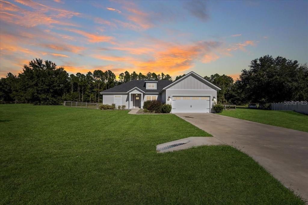 335 Southwest Arrowbend Drive Lake City, FL 32024 - Photo 2 of 50 a view of a house and a yard