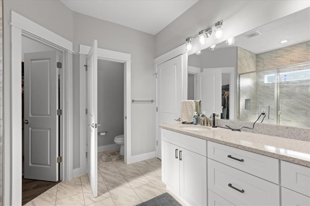 335 Southwest Arrowbend Drive Lake City, FL 32024 - Photo 27 of 50 a bathroom with a double vanity sink and a mirror