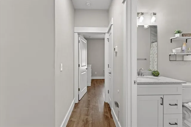 a view of a bathroom from the hallway