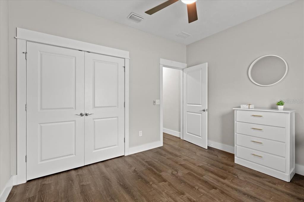 335 Southwest Arrowbend Drive Lake City, FL 32024 - Photo 31 of 50 wooden floor and closet in a room