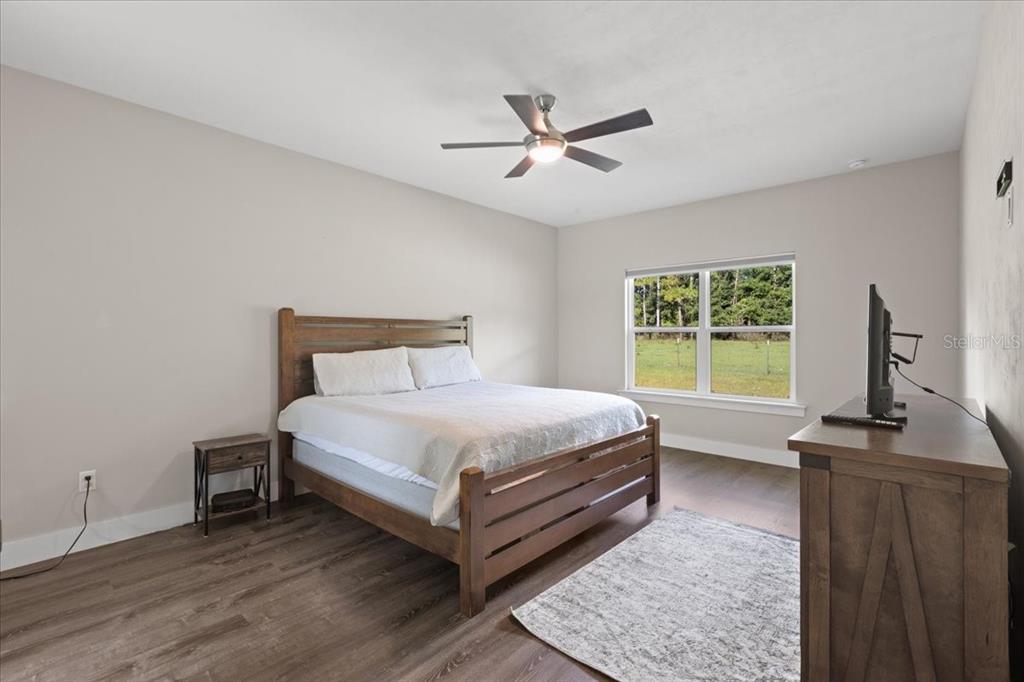 335 Southwest Arrowbend Drive Lake City, FL 32024 - Photo 32 of 50 a bedroom with a bed and a window