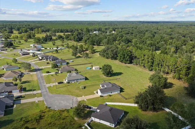 an aerial view of residential house with outdoor space