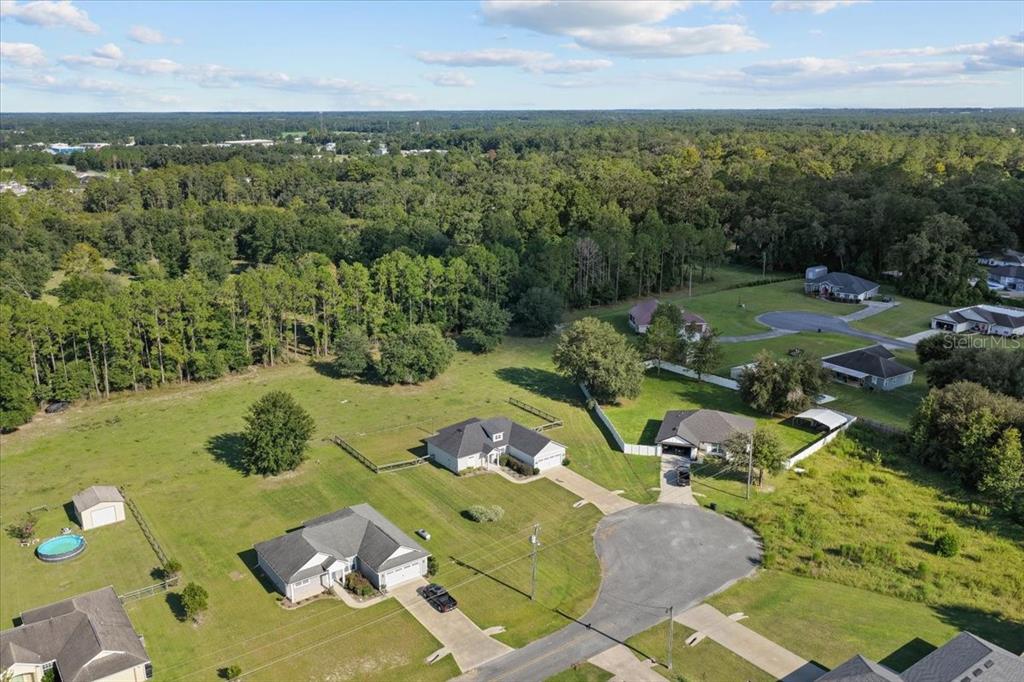 335 Southwest Arrowbend Drive Lake City, FL 32024 - Photo 40 of 50 an aerial view of a house with garden space and outdoor seating