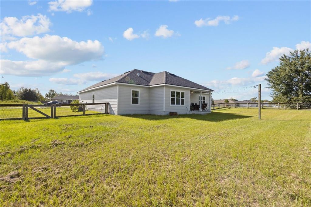 335 Southwest Arrowbend Drive Lake City, FL 32024 - Photo 7 of 50 a front view of a house with a yard