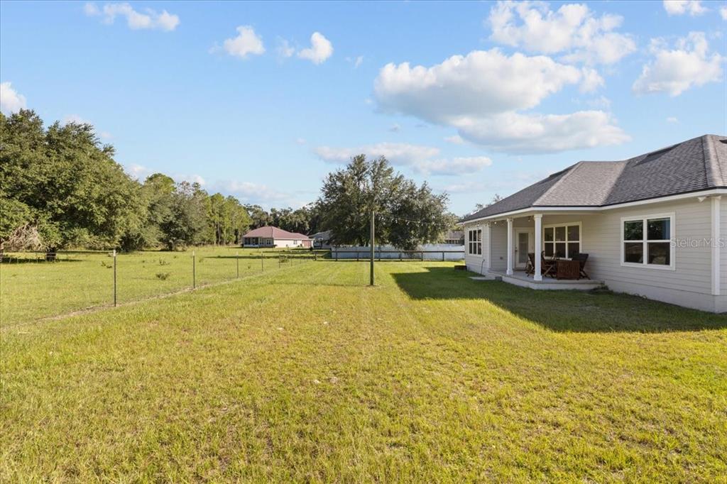 335 Southwest Arrowbend Drive Lake City, FL 32024 - Photo 8 of 50 a view of a house with swimming pool and a yard