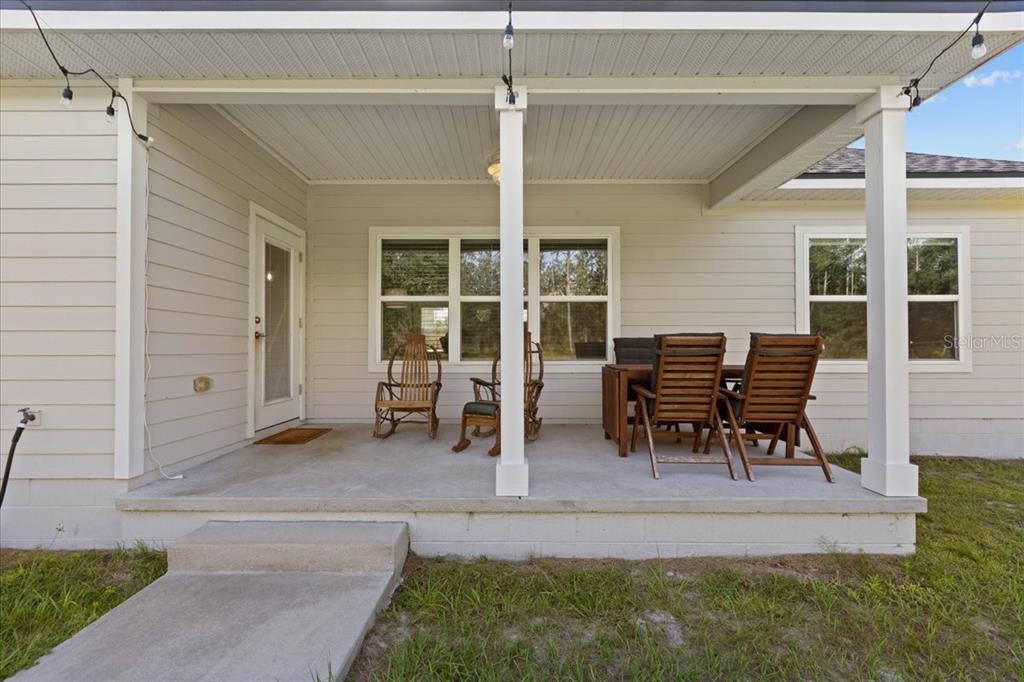 335 Southwest Arrowbend Drive Lake City, FL 32024 - Photo 9 of 50 a view of a house with backyard porch and sitting area