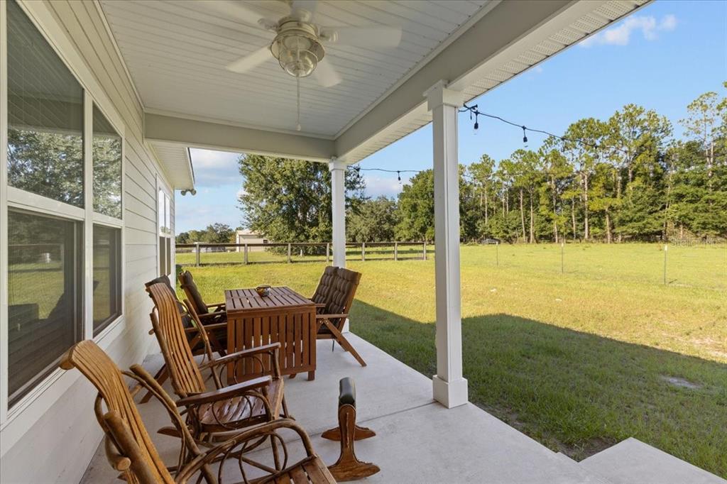 335 Southwest Arrowbend Drive Lake City, FL 32024 - Photo 10 of 50 a view of a porch with furniture and garden