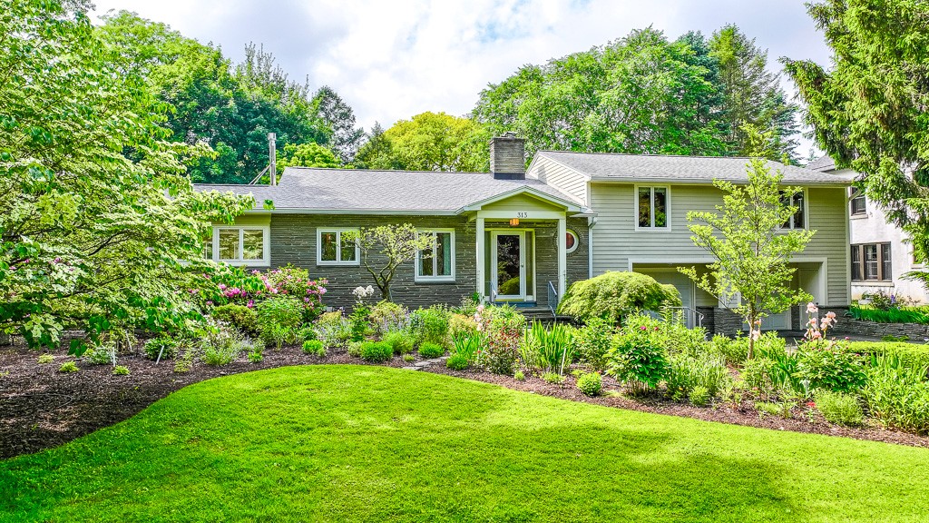 313 Pelham Road Brighton, NY 14610 - Photo 1 of 1 Tucked gracefully behind curated gardens and a mea