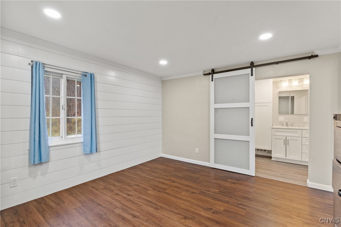 3860 South St Road Marcellus, NY 13108 - Photo 18 of 41 First Floor Primary Bedroom with Ensuite Bathroom