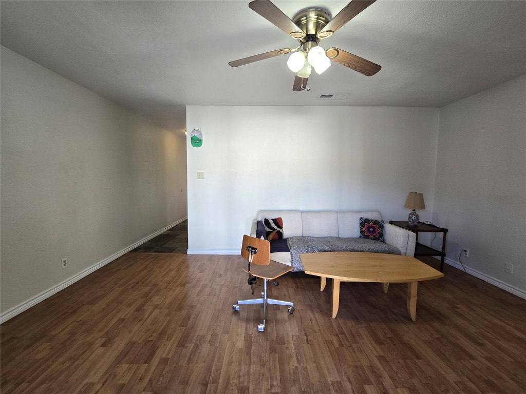 2600 Penny Lane, Unit 212 Austin, TX 78757 - Photo 12 of 35 a living room with furniture and a chandelier