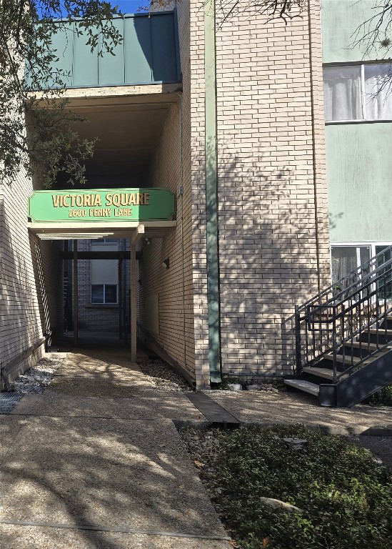 2600 Penny Lane, Unit 212 Austin, TX 78757 - Photo 2 of 35 a front view of a house with a yard