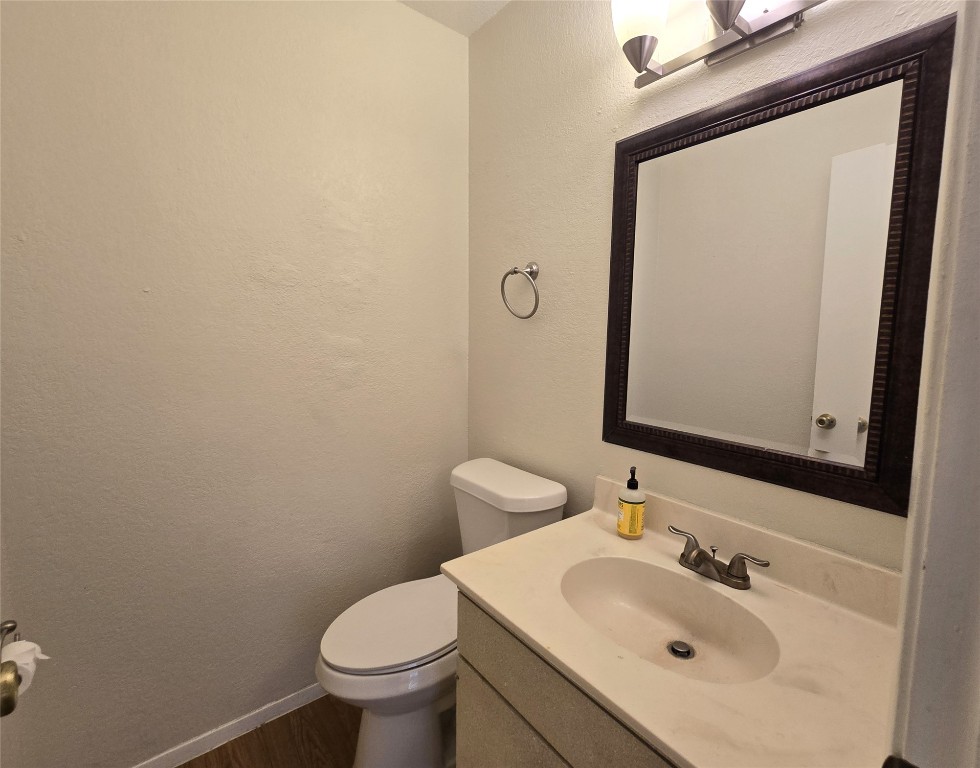 2600 Penny Lane, Unit 212 Austin, TX 78757 - Photo 24 of 35 a bathroom with a sink toilet and mirror