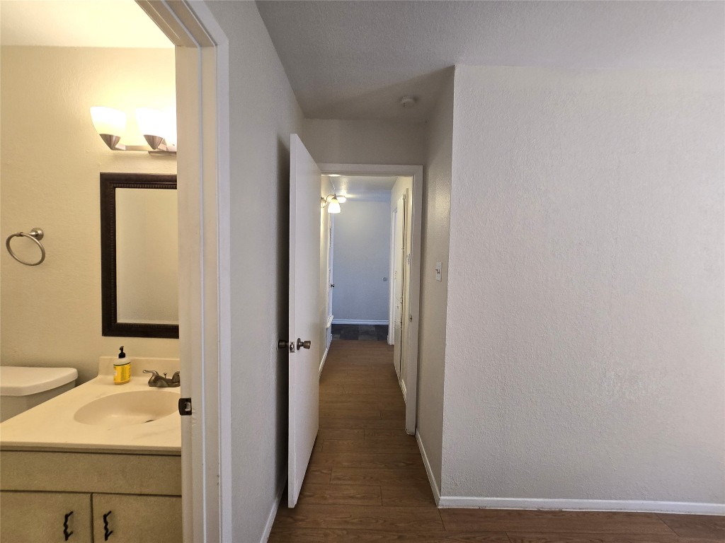 2600 Penny Lane, Unit 212 Austin, TX 78757 - Photo 25 of 35 a view of a bathroom from a hallway