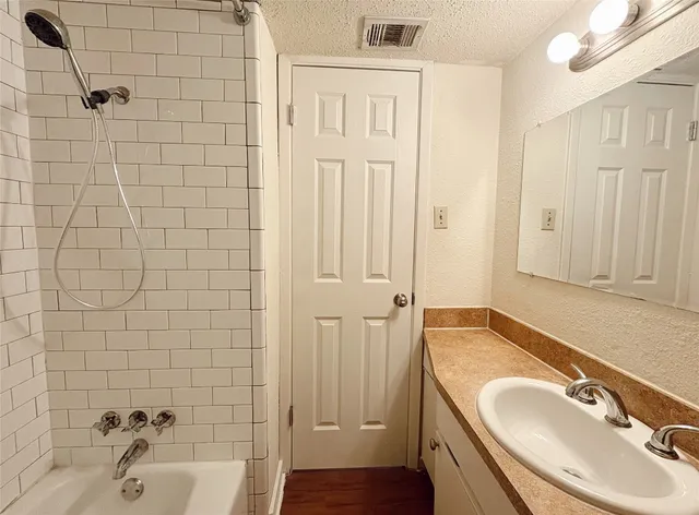 a bathroom with a sink and a tub