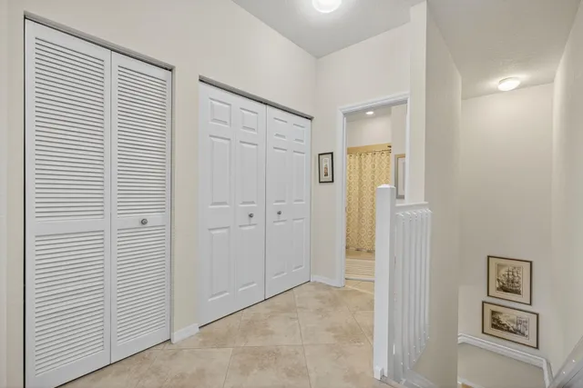 a view of a kitchen with refrigerator and cabinet