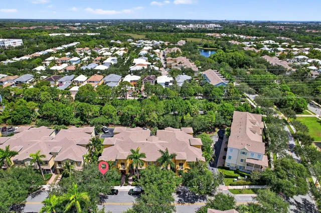 an aerial view of residential houses with outdoor space