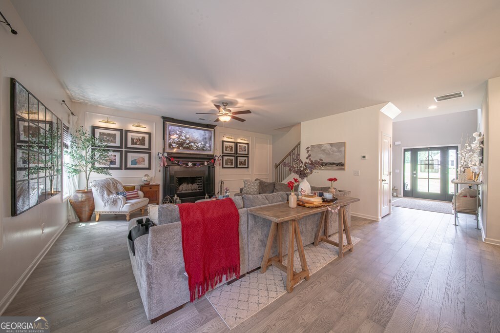 62 James Creek Road Fortson, GA 31808 - Photo 15 of 49 a living room with fireplace furniture and a wooden floor
