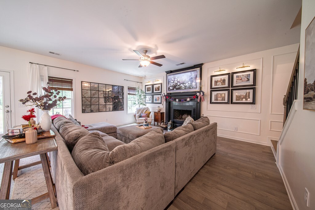 62 James Creek Road Fortson, GA 31808 - Photo 16 of 49 a living room with furniture and a fireplace