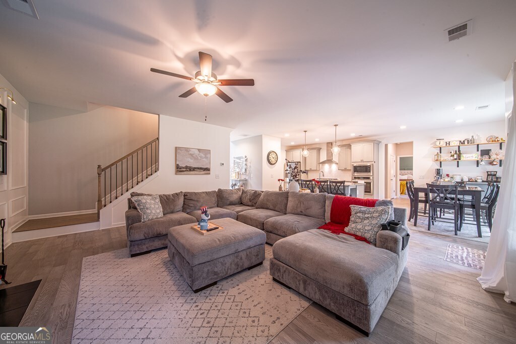 62 James Creek Road Fortson, GA 31808 - Photo 18 of 49 a living room with furniture and a ceiling fan