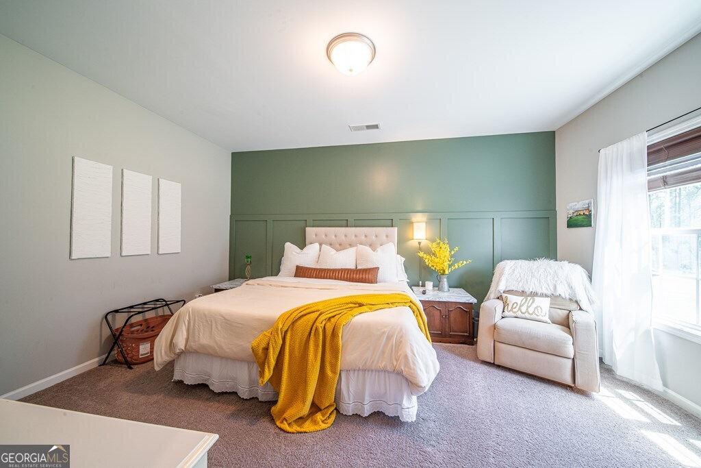 62 James Creek Road Fortson, GA 31808 - Photo 21 of 49 a bedroom with two beds and painting on the wall