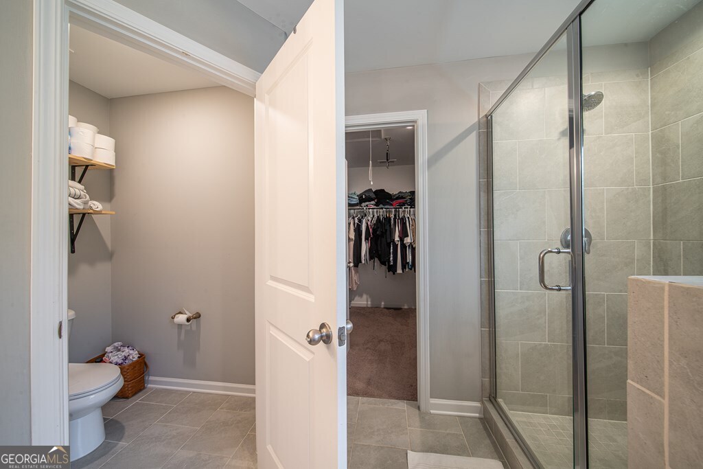 62 James Creek Road Fortson, GA 31808 - Photo 33 of 49 a bathroom with a toilet and a shower