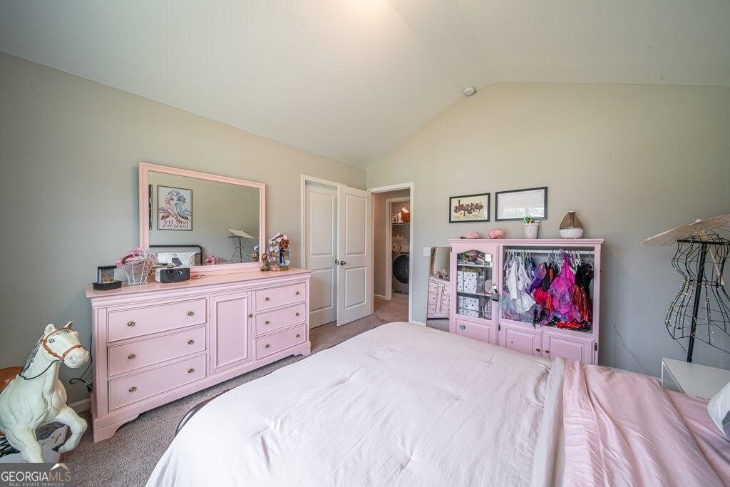 62 James Creek Road Fortson, GA 31808 - Photo 38 of 49 a bedroom with bed and painting on the wall