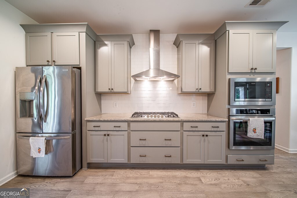 62 James Creek Road Fortson, GA 31808 - Photo 8 of 49 a kitchen with stainless steel appliances granite countertop a refrigerator stove and sink