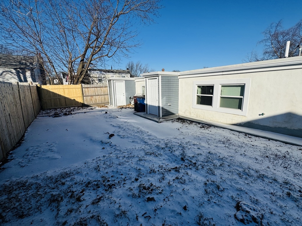 73 Victoria Street Revere, MA 02151 - Photo 22 of 24 a view of a house with backyard and trees